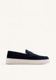 Navy slip-on penny loafers with decorative strap detail and contrasting flat soles