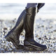 Women's tall winter boots with buckle strap and flat sole
