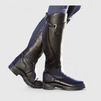 Tall winter boots with buckle straps and low heels