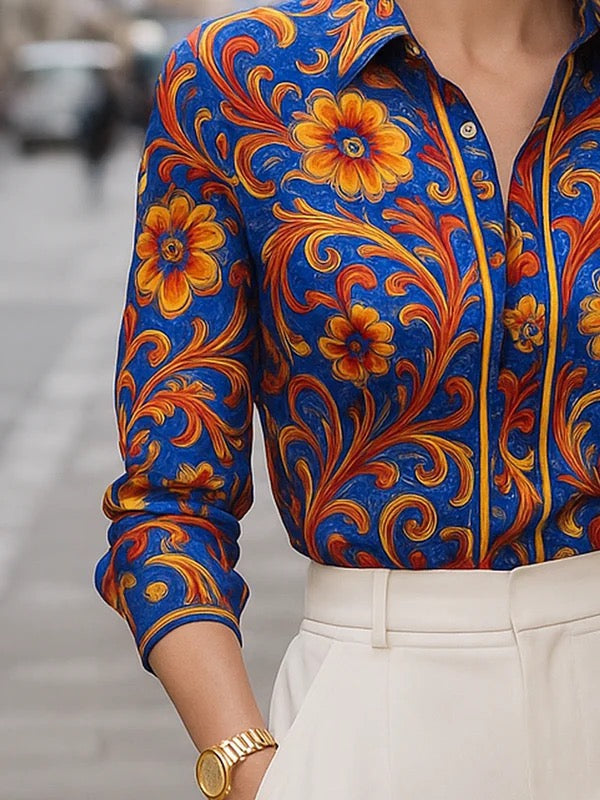 Women's blue floral button blouse with pointed collar and long sleeves