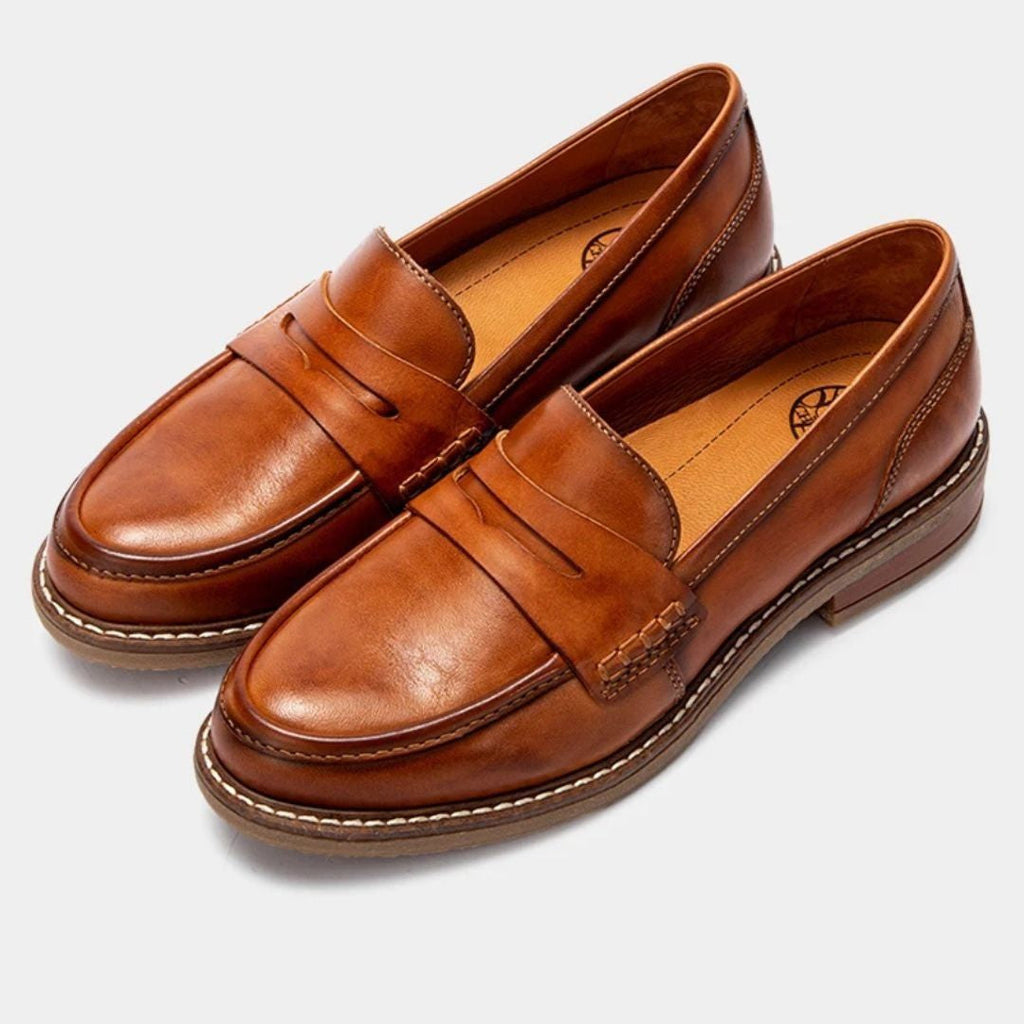 Men's penny loafers with rounded toes, stitched trim and low heels