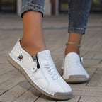 Low-top lace-up sneakers with side zip and flat contrasting soles