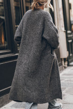 Women's oversized open front knit midi cardigan with long sleeves and front pockets