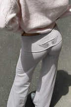 Women's relaxed hooded sweatshirt with sequin wing graphic on the back