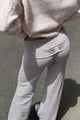 Women's relaxed hooded sweatshirt with sequin wing graphic on the back