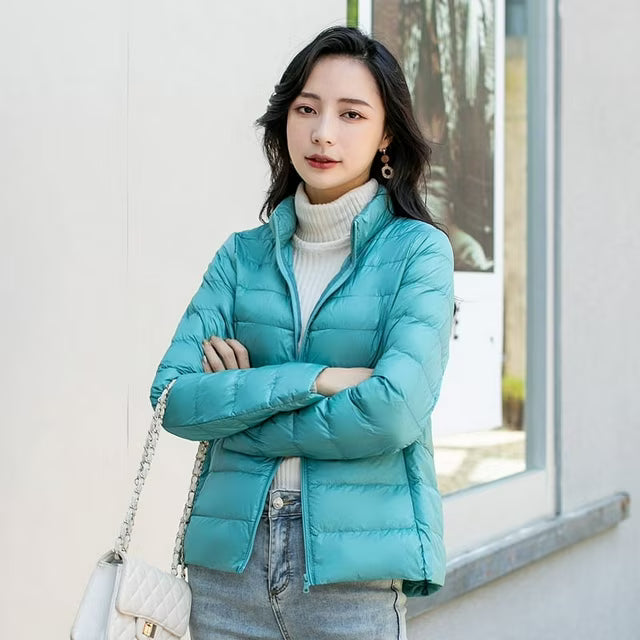 Women's quilted puffer jacket with high collar, long sleeves and front zip