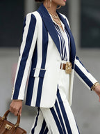 Women's navy and white striped blazer with notched lapels and long sleeves