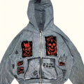 Men's grey zip-up hoodie with hood, graphic patches and front pockets