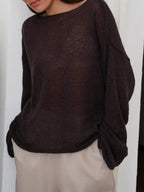 Women's open-knit oversized sweater with wide sleeves and crew neck