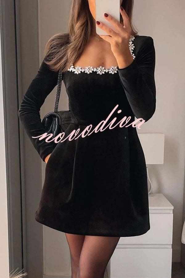 Women's velvet mini dress with embellished square neckline, long sleeves and flared skirt
