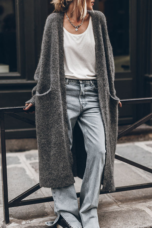 Women's oversized open front knit midi cardigan with long sleeves and front pockets