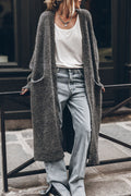 Women's oversized open front knit midi cardigan with long sleeves and front pockets