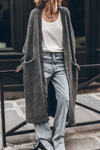 Women's oversized open front knit midi cardigan with long sleeves and front pockets