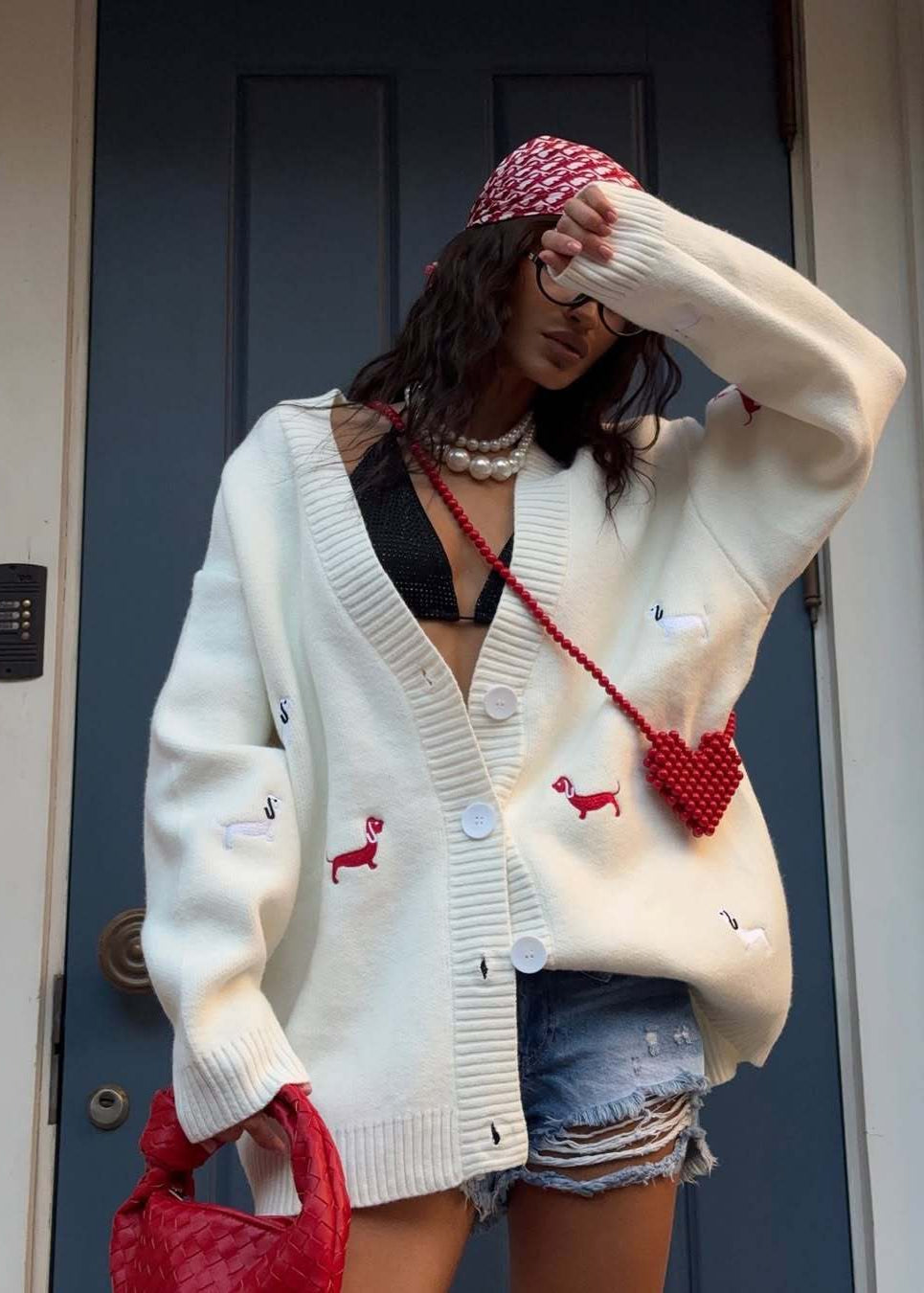 Women's oversized cable knit cardigan with buttons and embroidered motifs