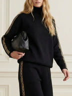 Women's black high neck sweatshirt with geometric sleeve trim