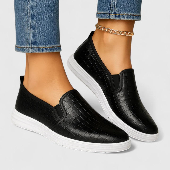 Plain dark brown slip-on loafers with front strap and low heel