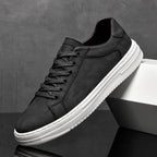 Classic low-top lace-up sneakers with textured upper and contrasting sole