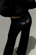 Women's relaxed hooded sweatshirt with sequin wing graphic on the back