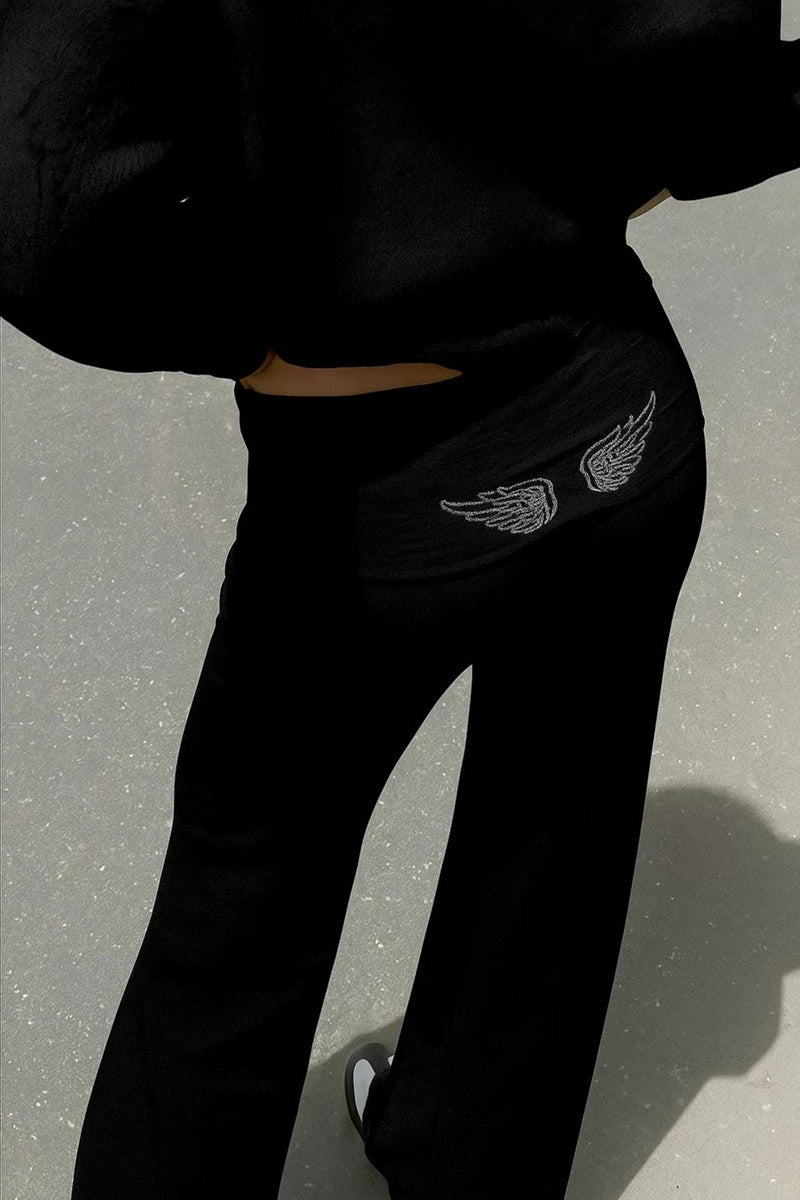 Women's relaxed hooded sweatshirt with sequin wing graphic on the back
