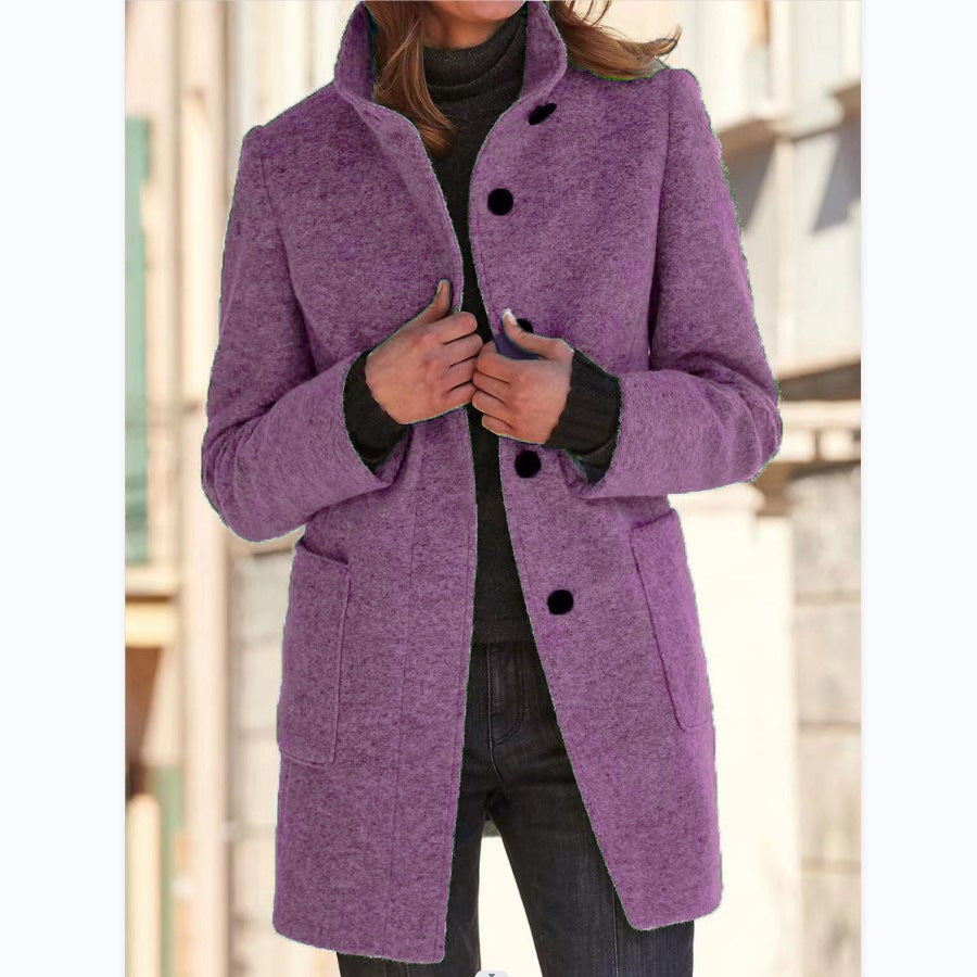 Women's button front coat with raised collar, long sleeves and front pockets