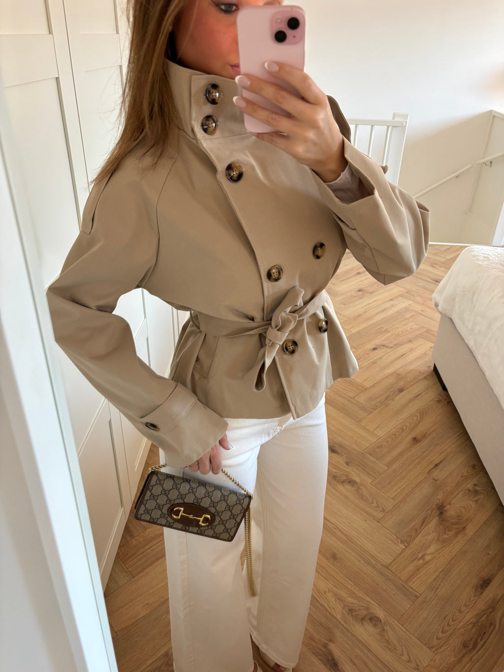 Women's beige cropped trench coat with high collar and waist belt