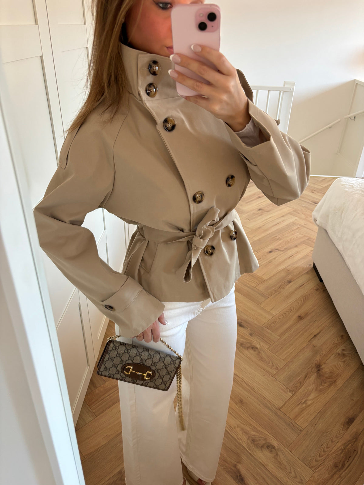 Women's beige cropped trench coat with high collar and waist belt