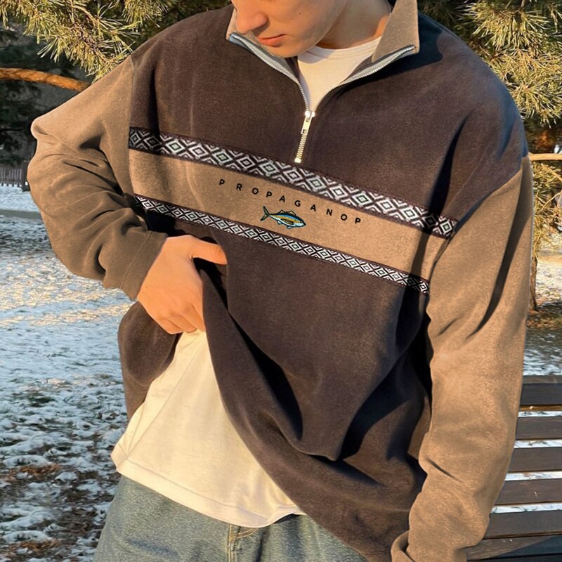 Men's geometric half-zip mock neck sweater with contrasting panels