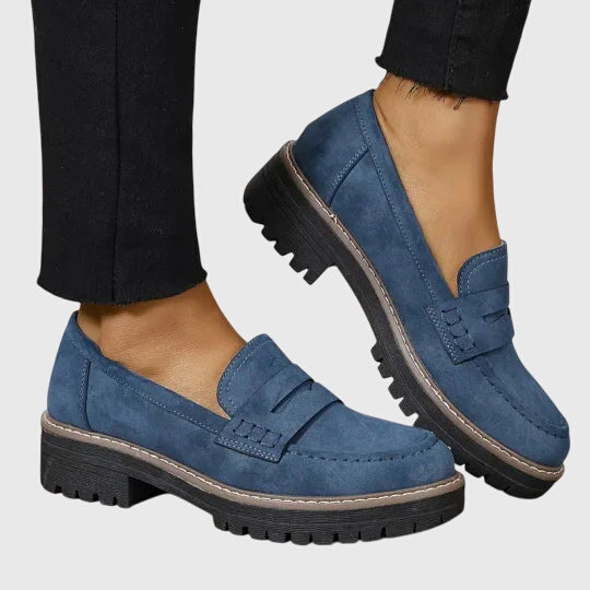 Women's penny loafers with round toes and low lug soles