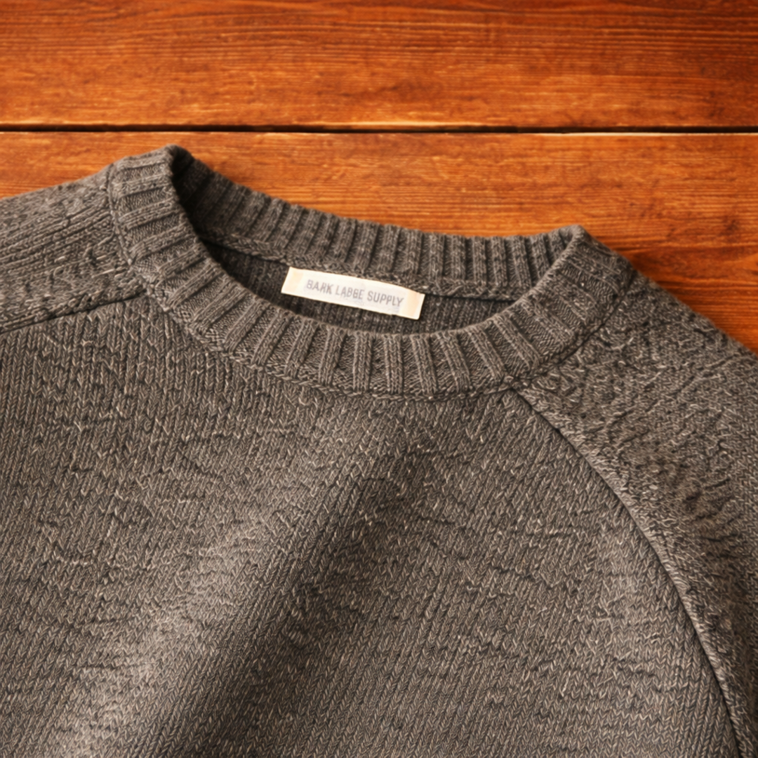Women's crew-neck knit sweater with raglan sleeves and elbow patches
