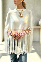 Women's knit cape sweater with crew neck and long tassel hem