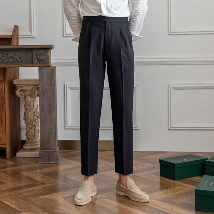 Women's high-waisted pleated straight-leg trousers shown in beige and black