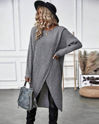 Women's long plain sweater dress with round neck, long sleeves and asymmetric hem