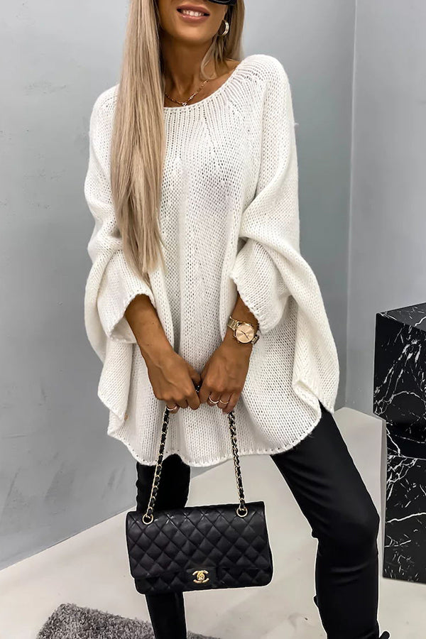 Women's loose knit poncho sweater with crew neckline and wide sleeves
