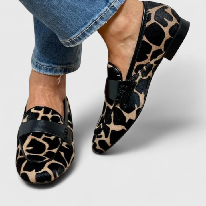 Women's leopard print loafers with black strap and low heel