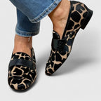 Women's leopard print loafers with black strap and low heel