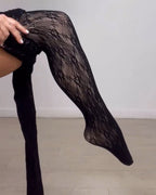 Black women's lace pattern footed leggings
