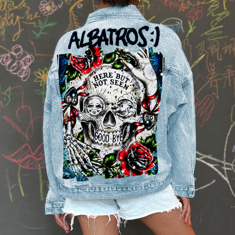 Women's light blue denim jacket with Halloween skull and rose graphic on the back
