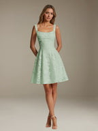 Women's sleeveless floral A-line mini dress with a square neckline