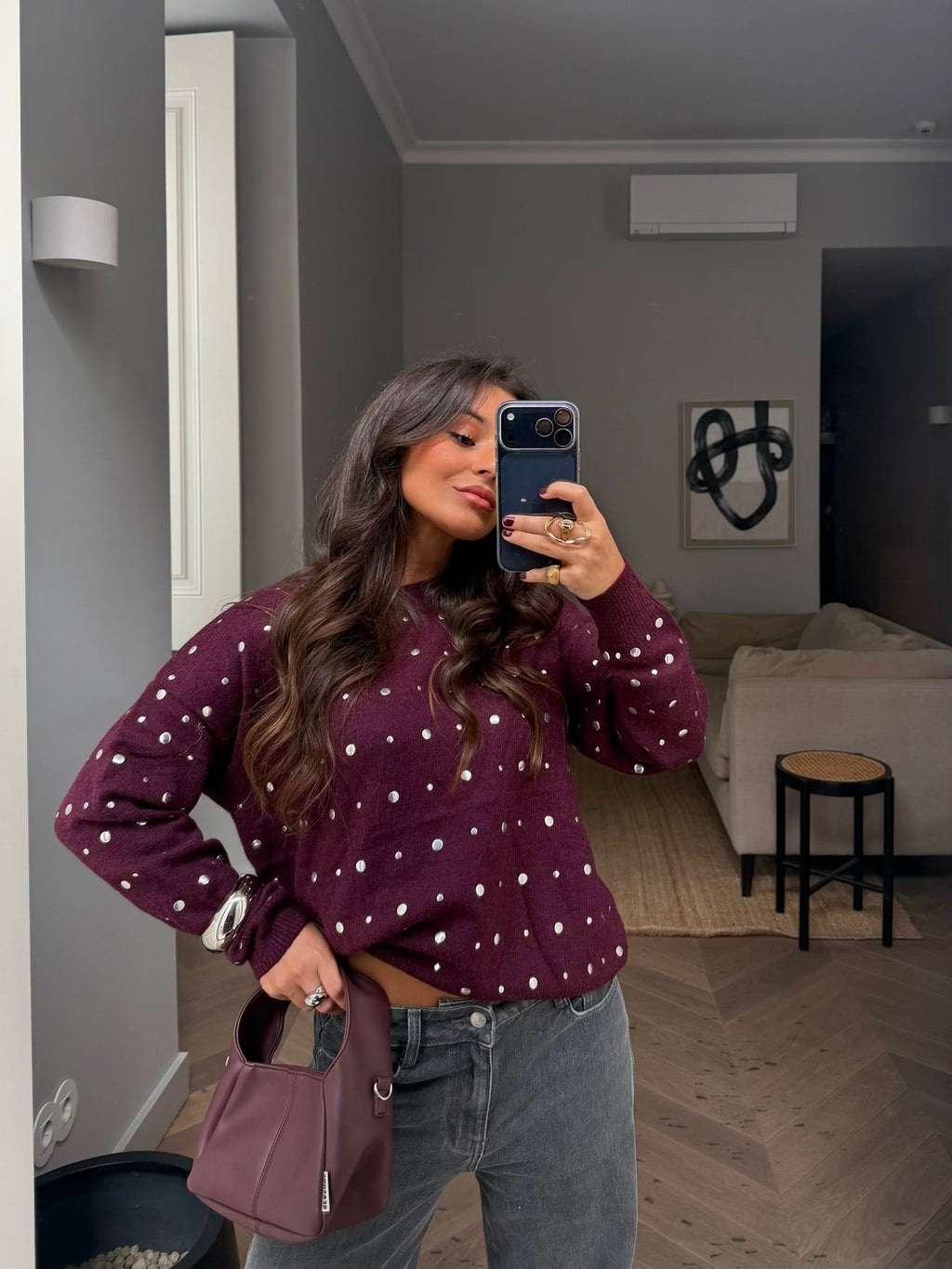 Women's burgundy sweater with scattered silver stud embellishments