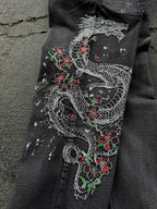 Dark washed wide leg jeans with dragon and floral embroidery