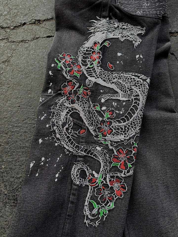 Dark washed wide leg jeans with dragon and floral embroidery