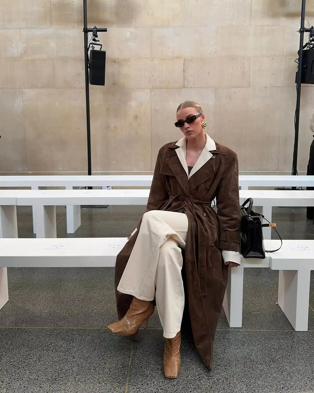 Women's brown long trench coat with contrast lapels and belted waist