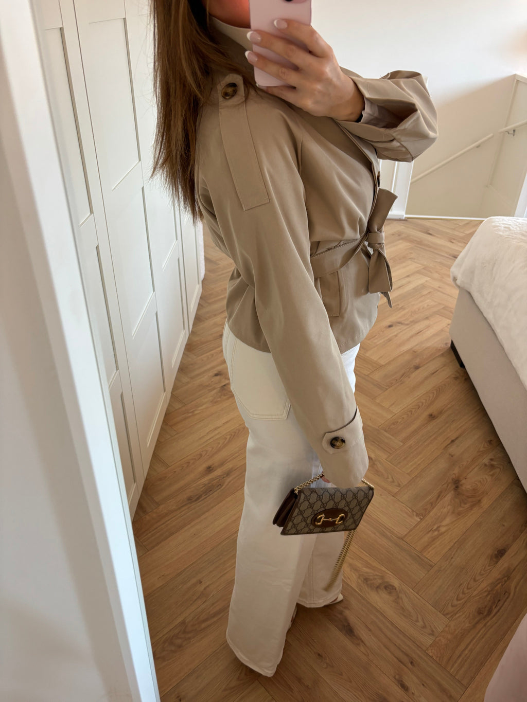 Women's beige cropped trench coat with high collar and waist belt