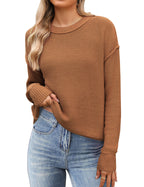 Women's black cropped knit sweater with crew neck and long sleeves