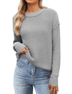 Women's black cropped knit sweater with crew neck and long sleeves