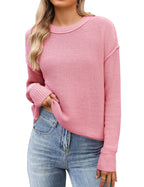 Women's black cropped knit sweater with crew neck and long sleeves