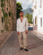 Men's white and taupe striped oversized shirt with open collar and long sleeves
