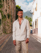 Men's white and taupe striped oversized shirt with open collar and long sleeves
