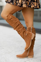 Women's knee-high slouch boots with low heels, side zips and buckle details