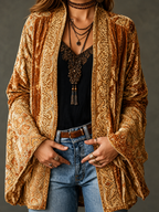 Women's long floral open-front cardigan with patterned borders and flared cuffs